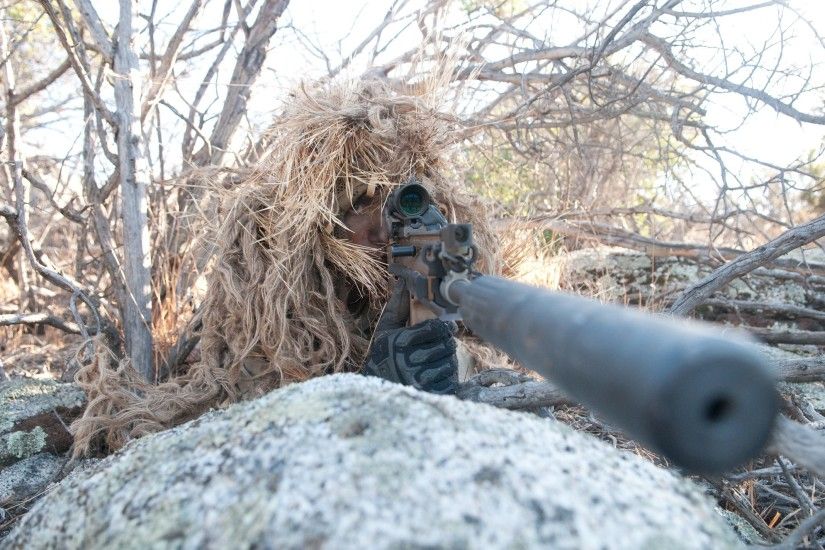 SEAL sniper properly concealed with clear bullet path. Photo courtesy U.S.  Navy.