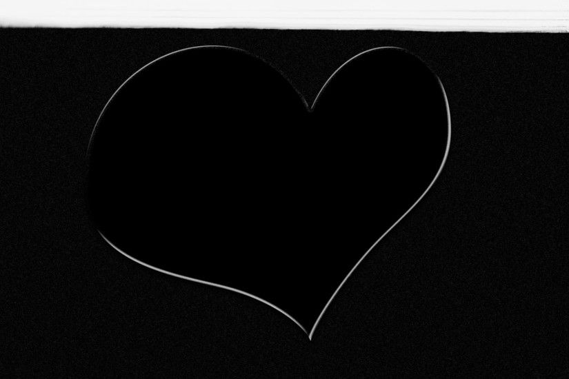 Hand drawn white heart on black background painted over with white paint.  Completely white screen at the final of clip. Valentines day artistic  background.