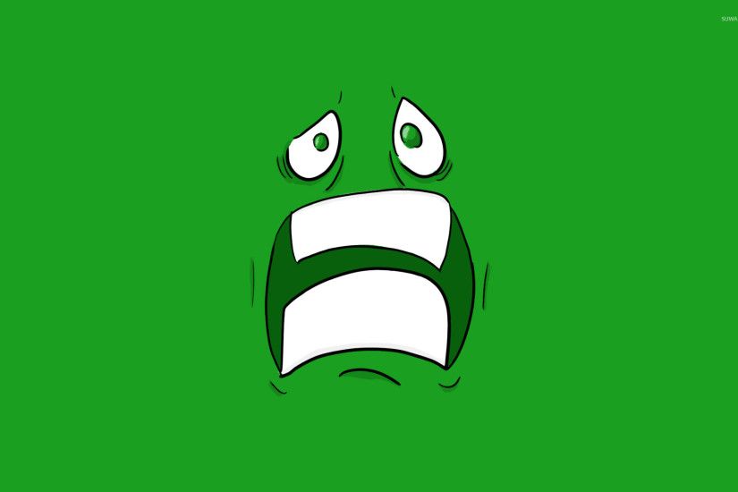Scared green face with green eyes wallpaper