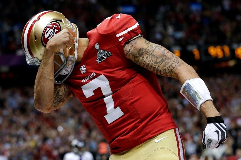 49ers quarterback Colin Kaepernick celebrates his touchdown against the  Baltimore Ravens during the second half of