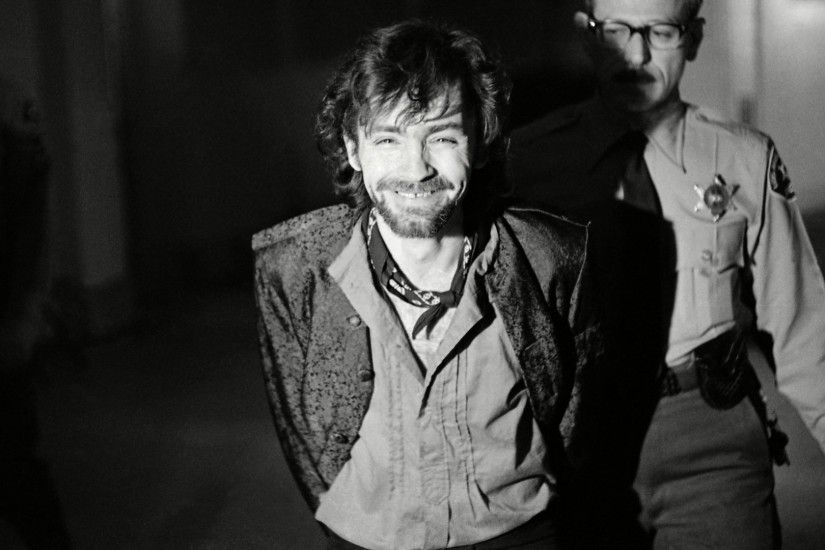 A smiling Charles Manson during a break in the Tate murder trial after an  outburst from