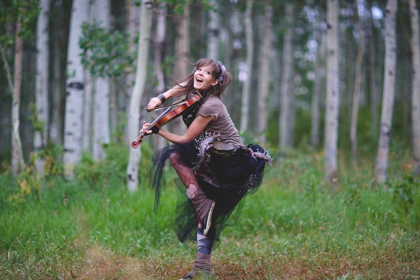 Lindsey Stirling Jumping in the Woods for 2560x1440