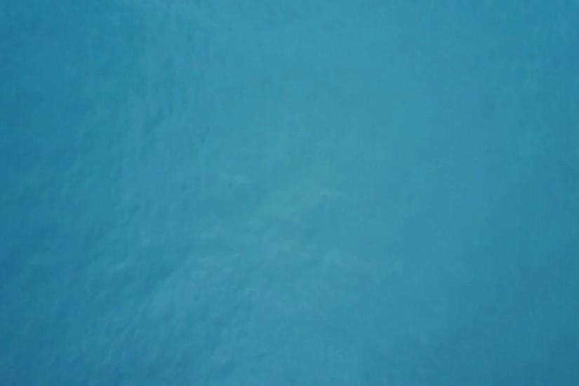 Flying over calm, deep blue color of sea water , background Stock Video  Footage - VideoBlocks