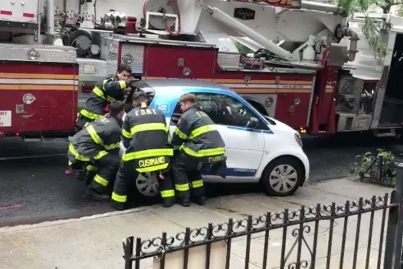 Watch FDNY Ladder 111's Men Pick Up a Smart Car Like It Were a Toy