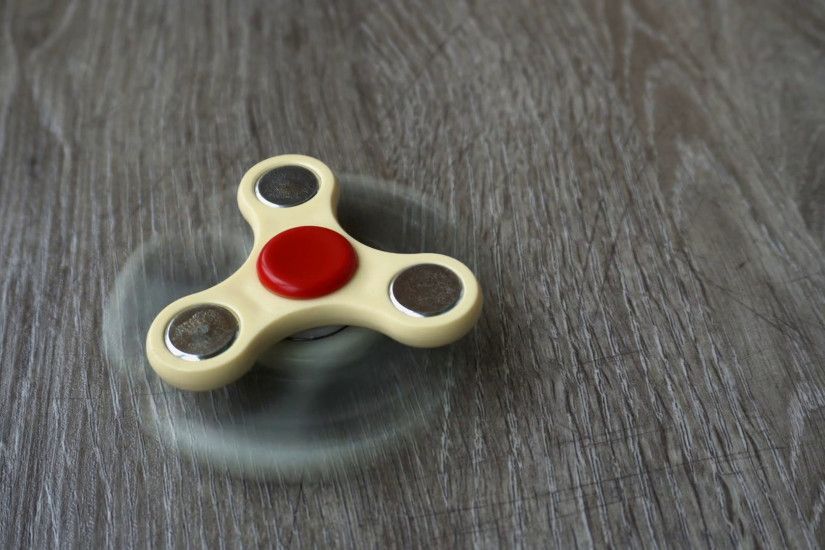 two white hand spinner spinning on grey background or fidget spinners Stock  Video Footage - VideoBlocks