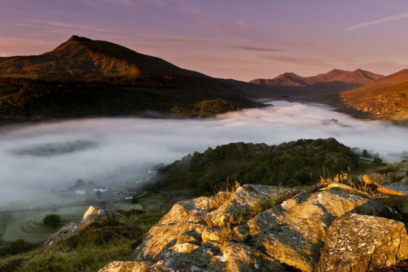england united kingdom uk wales wales town of capel curig morning first  rays fog valley mountain