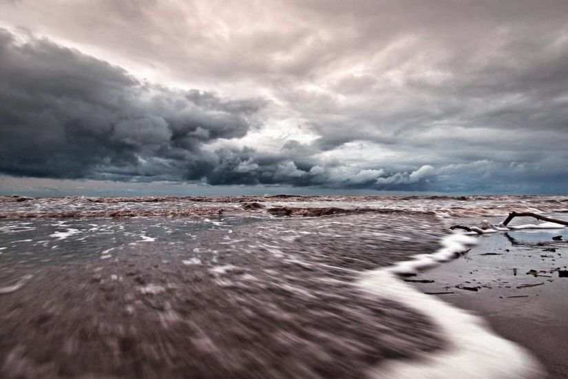 Tide Coming In Under Stormy Skies wallpaper