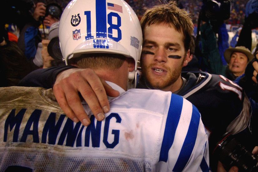 New England Patriots quarterback Tom Brady, right, talks with Indianapolis  Colts quarterback Peyton Manning