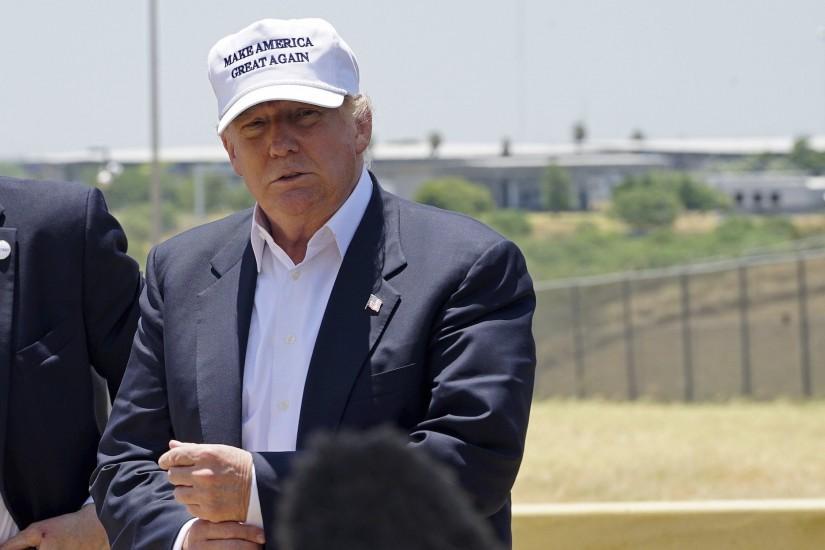 President Donald Trump near the US-Mexico border (background), outside  Laredo, Texas.Reuters/Rick Wilking