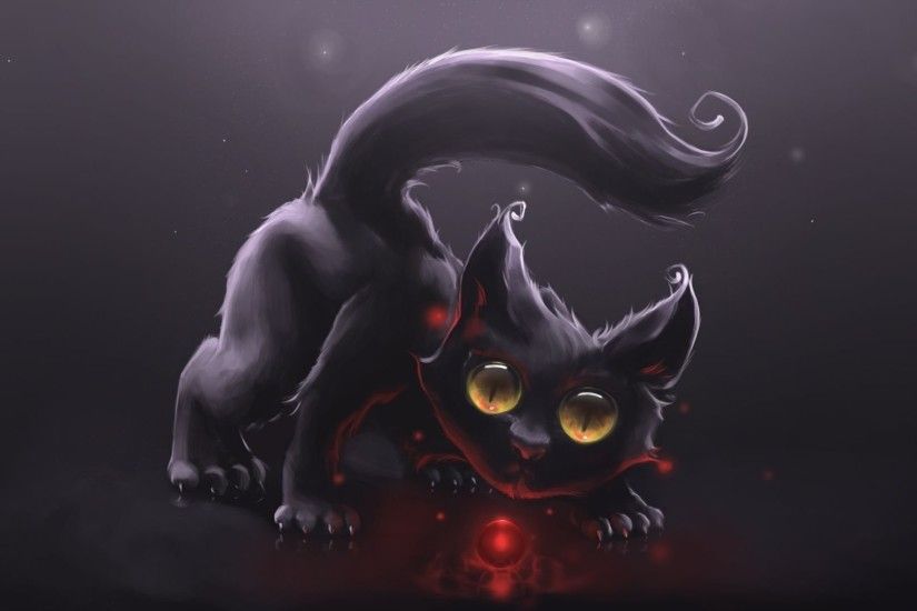 Cute Black Cat Playing With A Red Orb