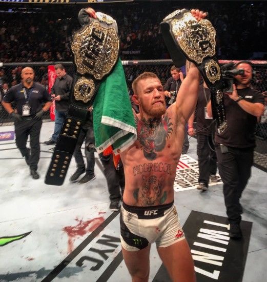 Conor McGregor - First to hold two belts in two different weight classes  simultaneously