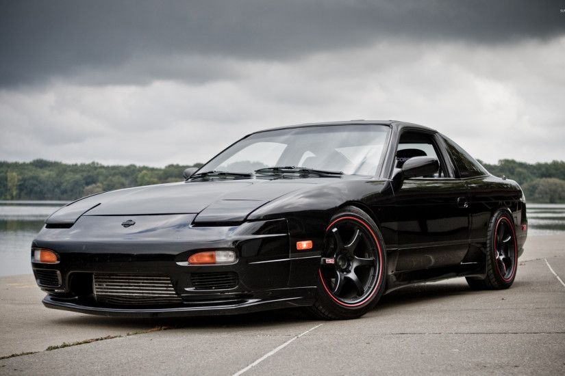 Front side view of a black Nissan 240SX wallpaper .