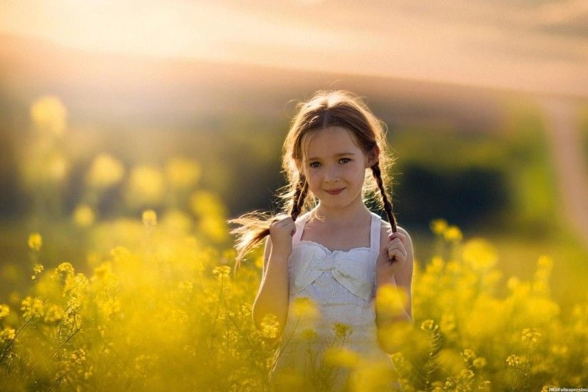 Cute Baby Girl in Yellow Flowers Field HD Desktop Wallpaper