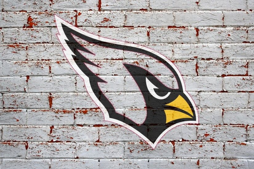 arizona cardinals logo on grey brick wall