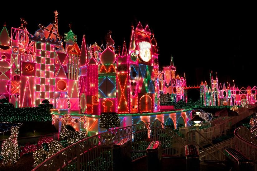 It's a Small World attraction at Disneyland at night decorated for Christmas  wallpaper