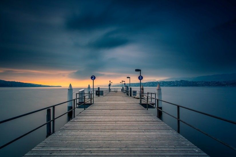 wooden pier in the evening with wide landscape picture