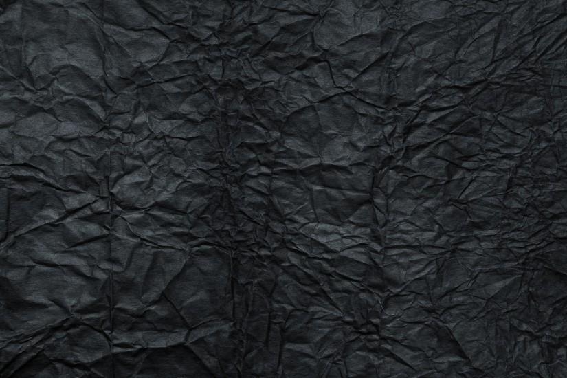 Crumpled black paper