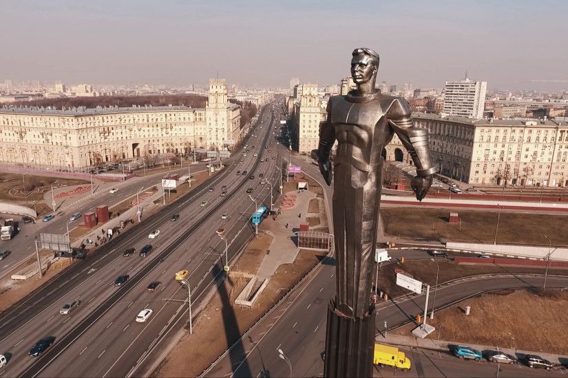 Bird eye view of Yuri Gagarin metal statue on road rush traffic crossroad  in city under clear blue sky on summer sunny day Stock Video Footage -  VideoBlocks