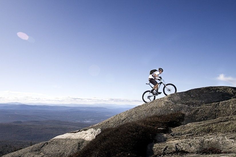 Climbing the mountain on a bike picture