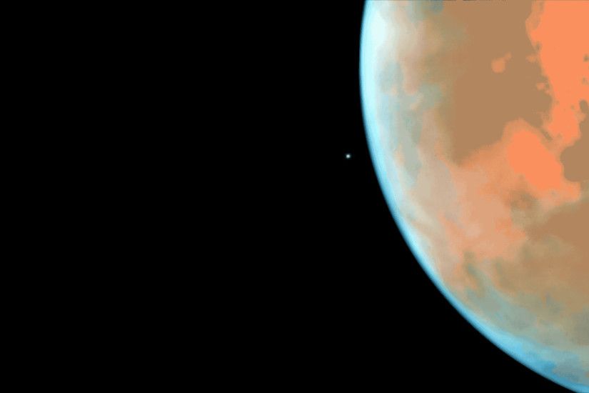 The tiny Martian moon Phobos orbits the Red Planet in this animation of  images from the Hubble Space Telescope. Please click the animation to  enlarge it.