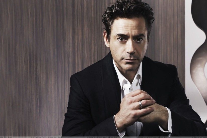 Robert Downey, Jr Sitting Pose In Black Coat 08 Aug 2012