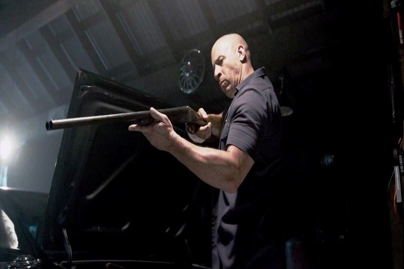 Popular Hollywood Actor Vin Diesel with Gun in English Movie Fast and Furious  7 HD Wallpapers