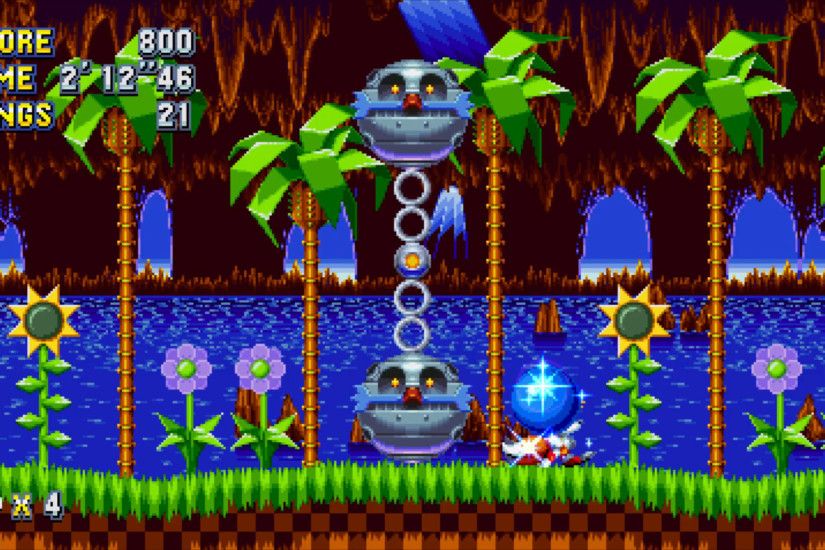 The very first boss in Sonic Mania's Green Hill Zone is pretty simple to  beat. The upper robot ball swings another robot ball beneath it.