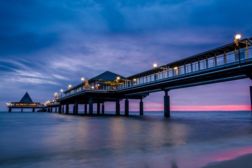 sea beach pier bridge night blue lilac sky clouds magenta sunset lighting  lights light lamps christmas
