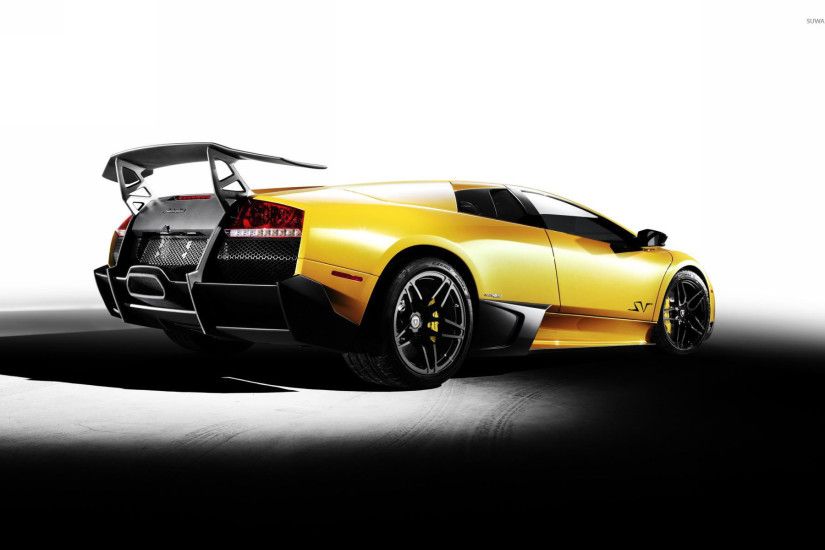 Back side view of a yellow Lamborghini Murcielago wallpaper