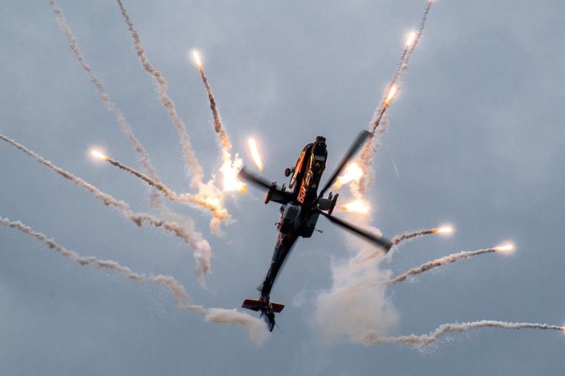 Apache helicopters releasing flares in the 2nd wallpaper at an air show